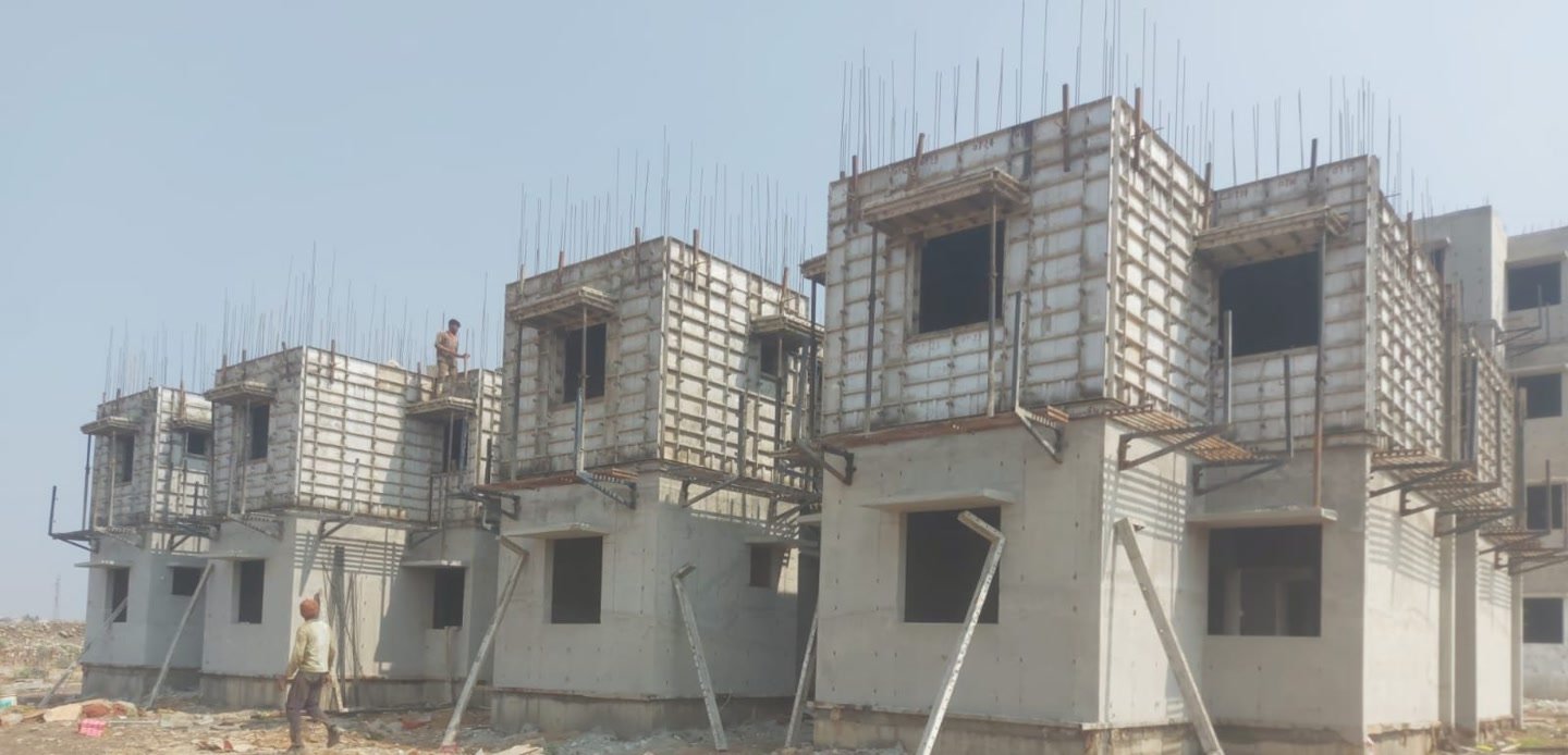 Rows of G plus three houses under construction at Talikoti with A.S. Betgeri aluminium centering in place.